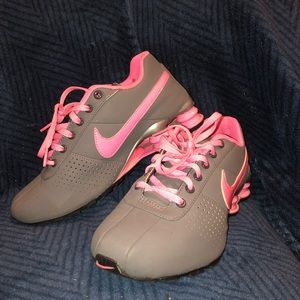 Pink and grey Nike Shock gym shoes